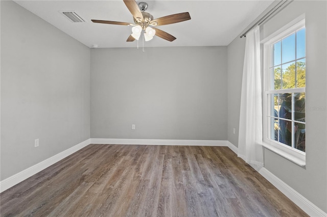 spare room with ceiling fan and hardwood / wood-style floors