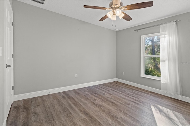 spare room featuring hardwood / wood-style floors, a textured ceiling, and ceiling fan