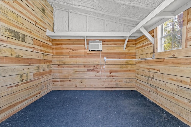 interior space with a wall mounted air conditioner