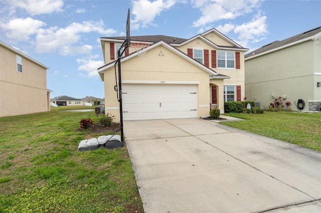 view of property with a front yard and a garage