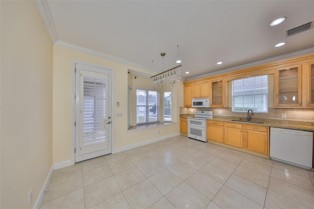 kitchen featuring white appliances, crown molding, light stone countertops, sink, and light tile patterned flooring