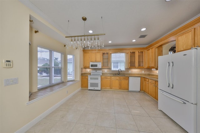 kitchen with crown molding, sink, decorative light fixtures, light tile patterned floors, and white appliances