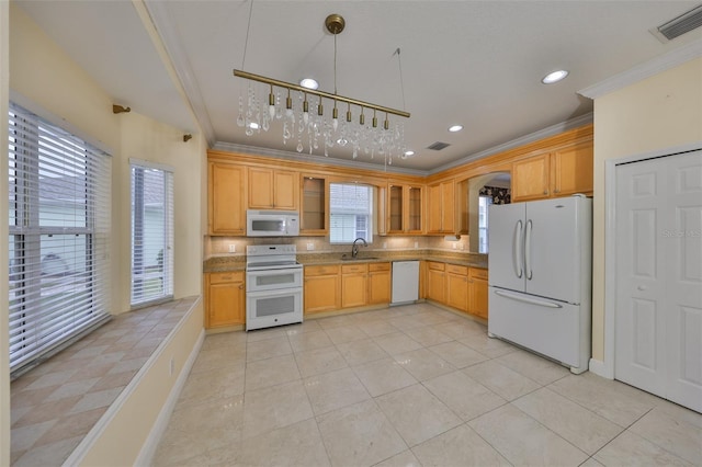 kitchen with crown molding, light brown cabinets, sink, a wealth of natural light, and white appliances