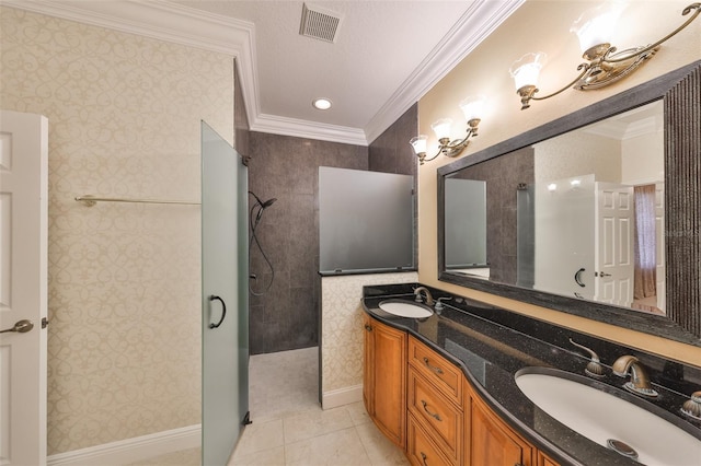 bathroom featuring a shower, tile patterned floors, vanity, and ornamental molding