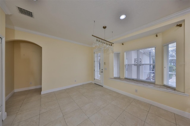 unfurnished dining area featuring visible vents, baseboards, ornamental molding, and light tile patterned floors