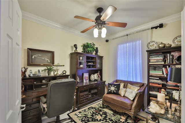 office area with ceiling fan and crown molding