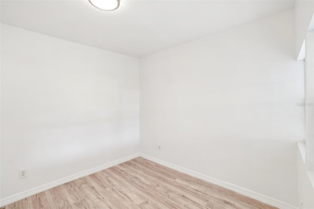 unfurnished room with light hardwood / wood-style floors