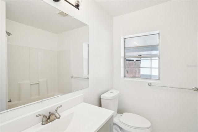 full bathroom featuring vanity, toilet, and washtub / shower combination