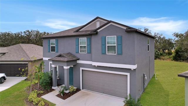 view of front of property featuring a garage and a front lawn