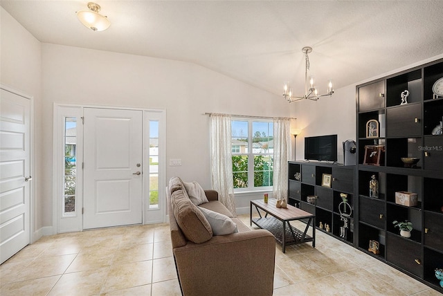 interior space with light tile patterned floors, an inviting chandelier, and vaulted ceiling