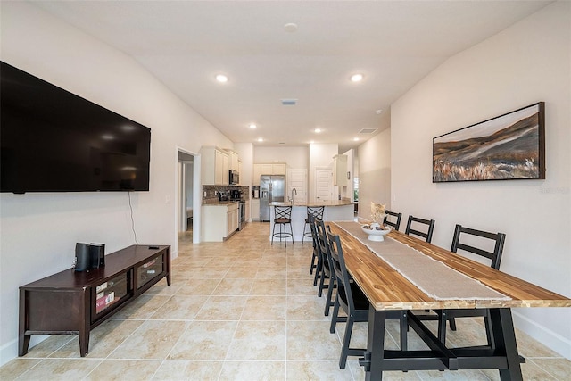 tiled dining area with sink