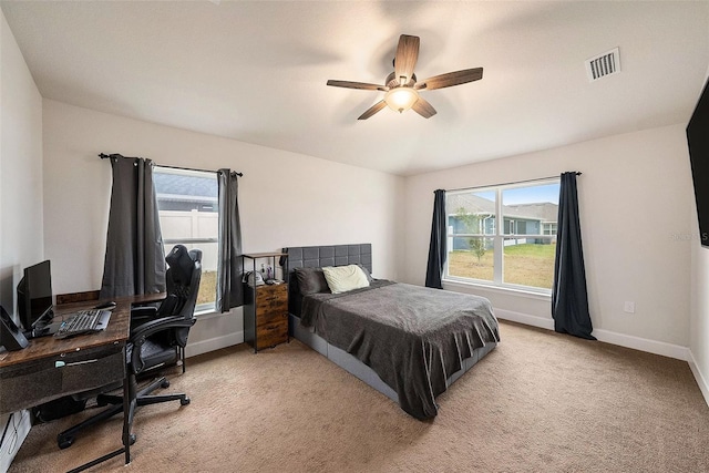 carpeted bedroom featuring ceiling fan