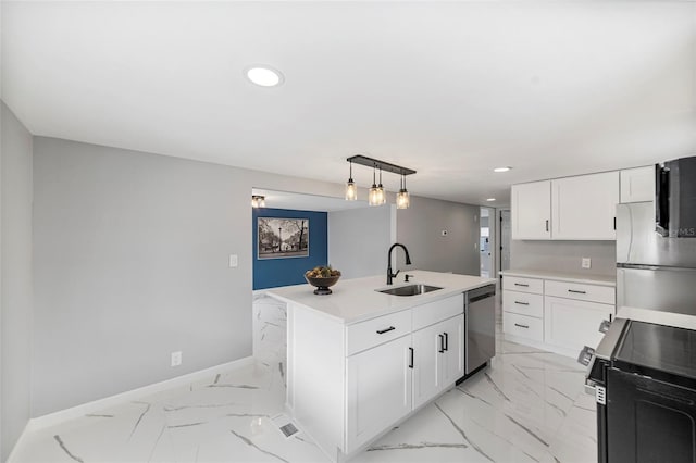 kitchen with white cabinets, stainless steel appliances, sink, hanging light fixtures, and a kitchen island with sink