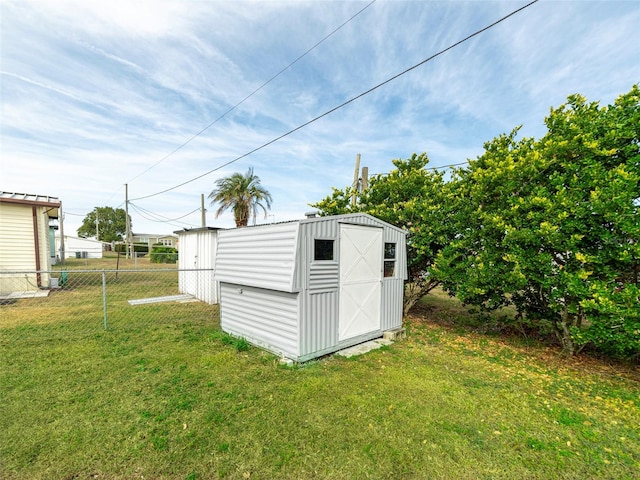 view of shed with fence