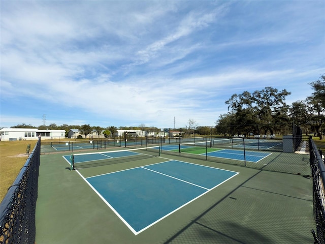 view of tennis court with fence