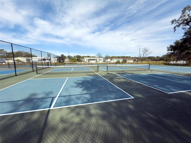 view of tennis court with fence