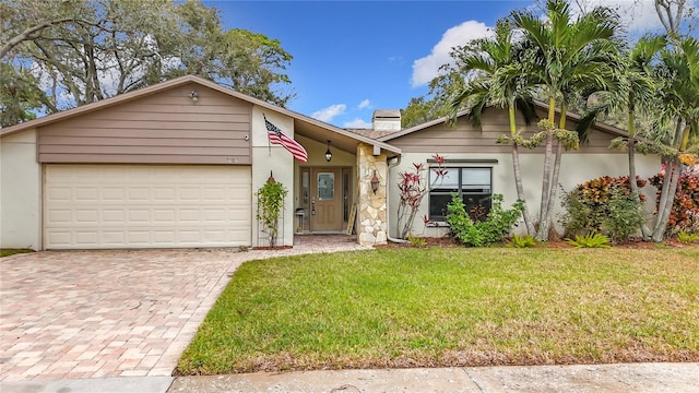 single story home with a garage and a front yard