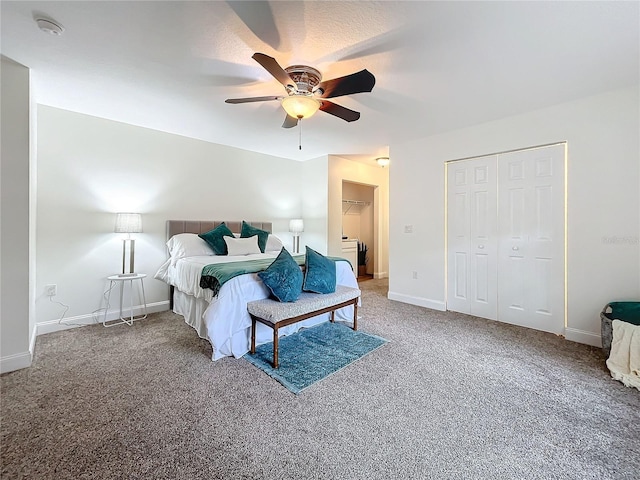 carpeted bedroom with ceiling fan and a closet