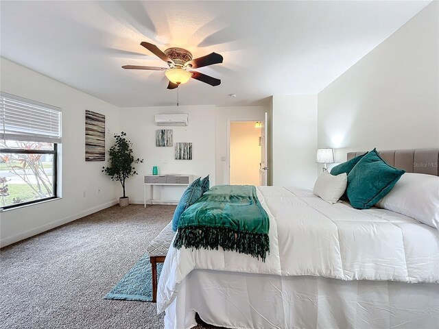 bedroom with carpet floors, a wall mounted air conditioner, and ceiling fan