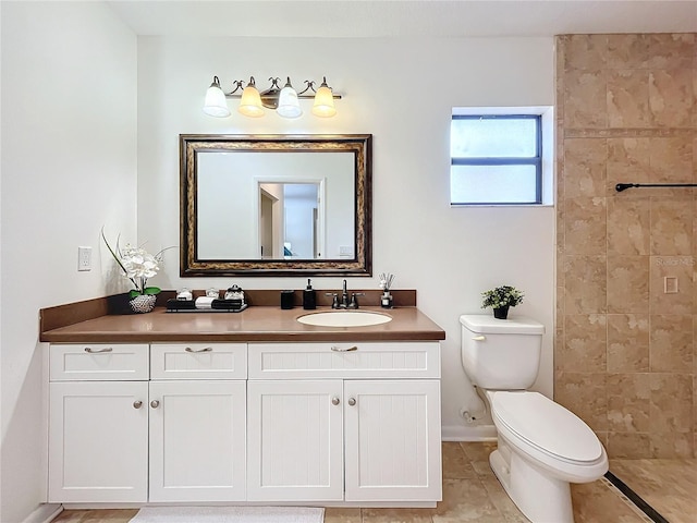 bathroom featuring tile patterned floors, vanity, and toilet