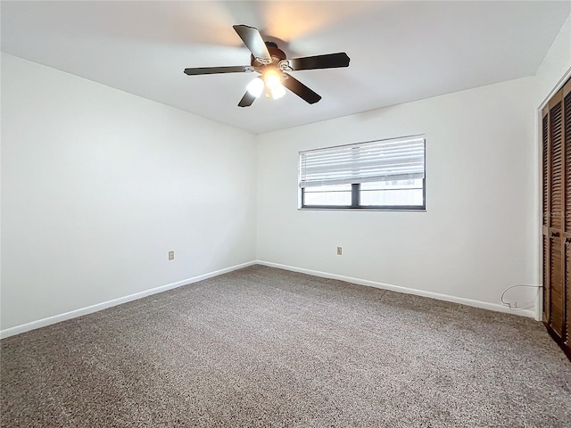 unfurnished room featuring carpet and ceiling fan