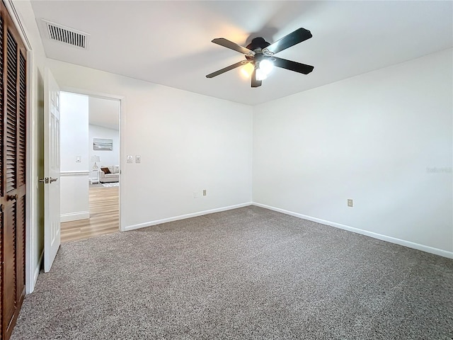 unfurnished bedroom featuring a closet, ceiling fan, and carpet