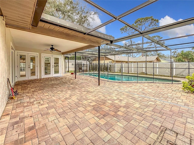 view of pool featuring a patio, a lanai, french doors, and ceiling fan