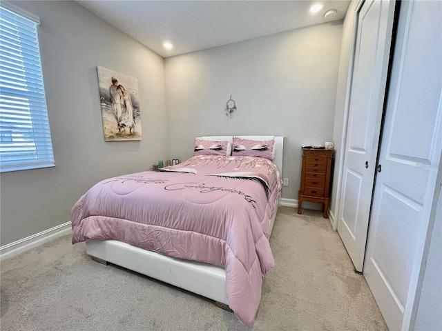 carpeted bedroom featuring a closet