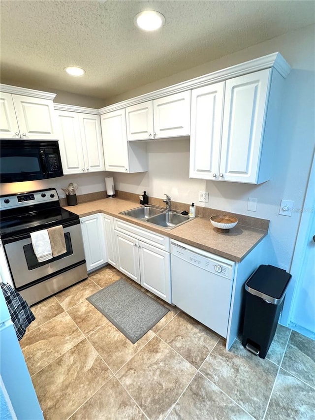 kitchen with sink, white cabinets, dishwasher, and stainless steel range with electric cooktop