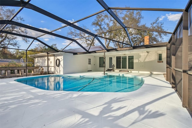 pool featuring a lanai and a patio