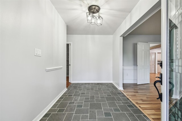 interior space featuring dark wood-style floors and baseboards