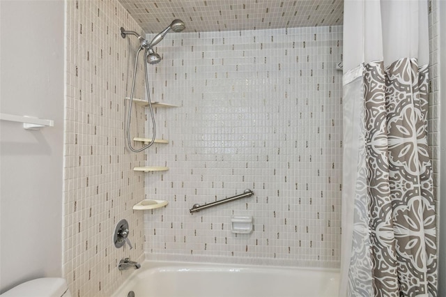 full bathroom with shower / bath combo and toilet