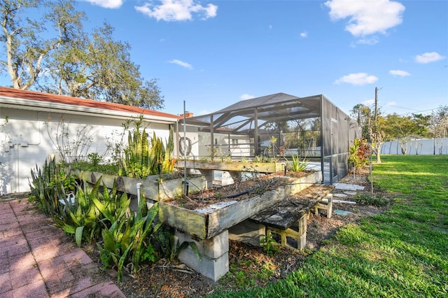 exterior space with a garden and glass enclosure