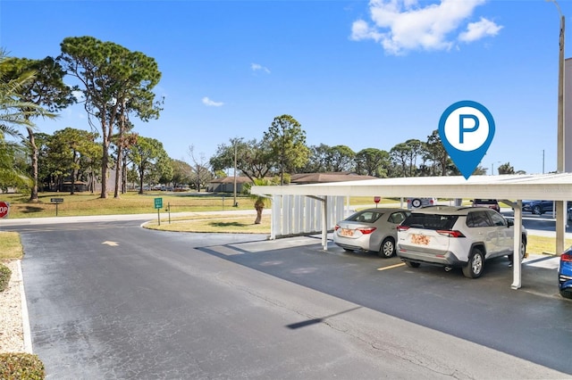 exterior space featuring a carport and a yard