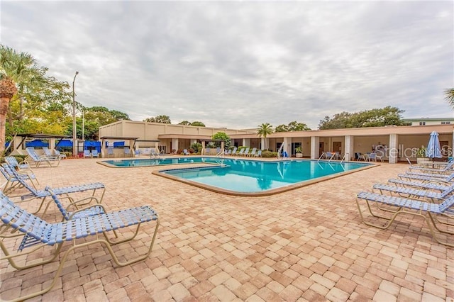 view of swimming pool featuring a patio area