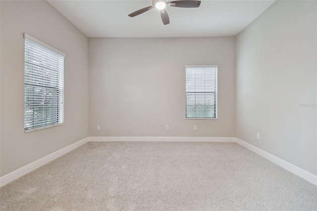 carpeted empty room with ceiling fan