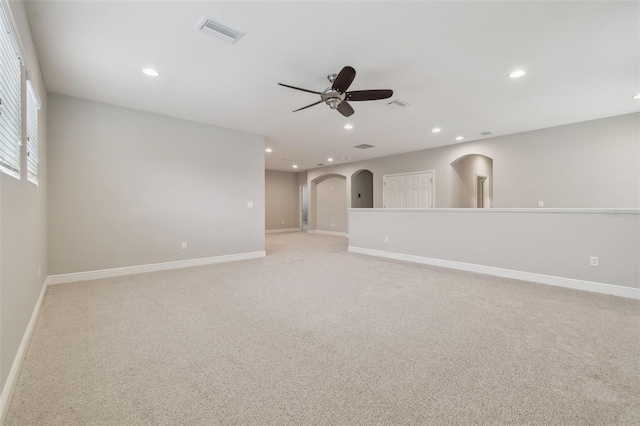 carpeted empty room with ceiling fan