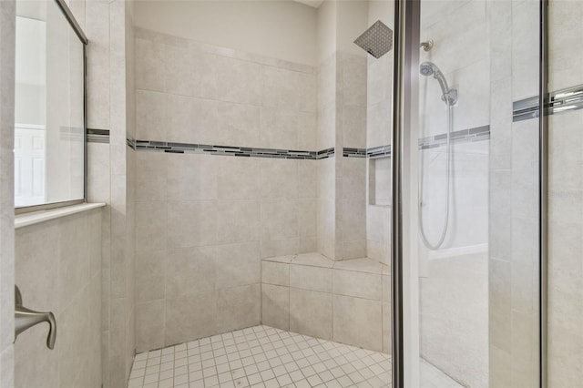 bathroom with a tile shower