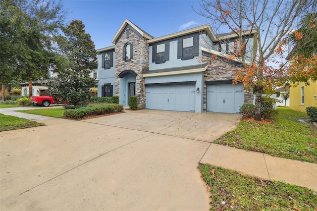 view of front facade with stucco siding, an attached garage, stone siding, and concrete driveway