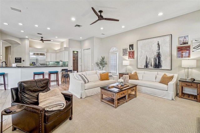 living room featuring ceiling fan