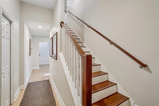 staircase featuring hardwood / wood-style flooring