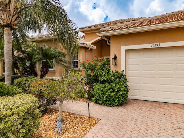 mediterranean / spanish-style house featuring a garage