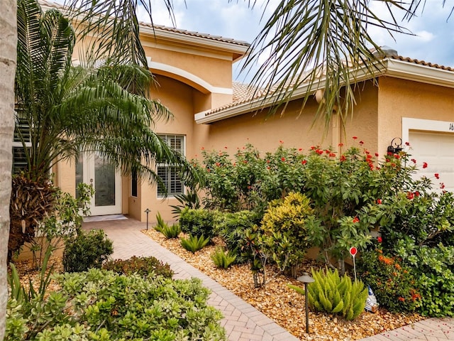 view of property exterior featuring a garage