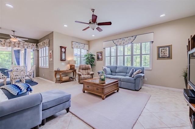 tiled living room featuring ceiling fan