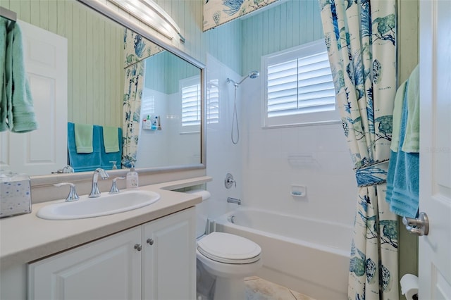 full bathroom with tile patterned flooring, vanity, shower / bathtub combination with curtain, and toilet