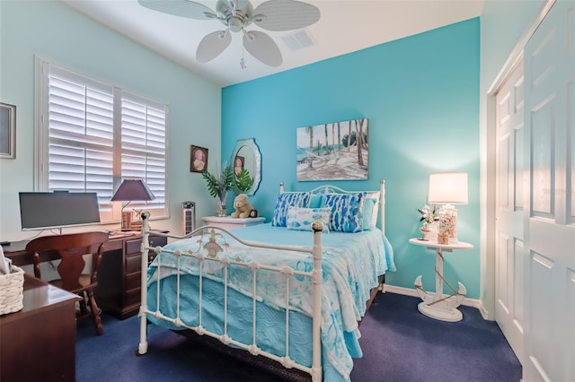 bedroom with ceiling fan, carpet floors, and a closet