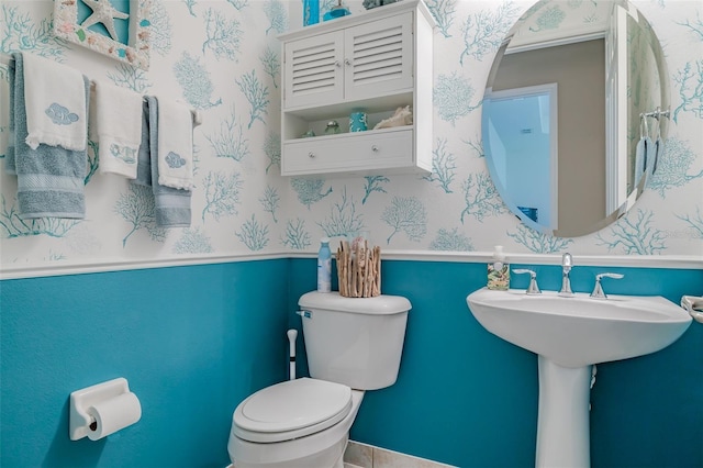 bathroom with toilet and sink