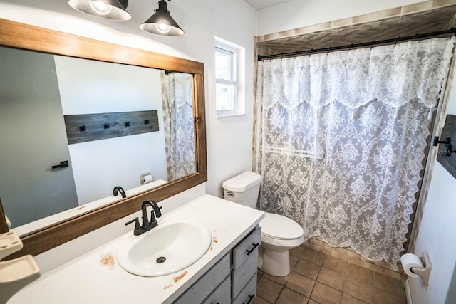 bathroom with a shower with curtain, toilet, tile patterned floors, and vanity