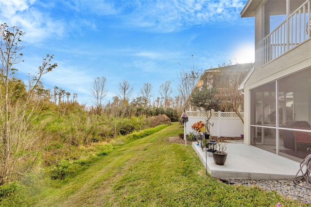 view of yard with a patio and a sunroom