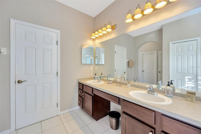 bathroom featuring tile patterned flooring and vanity